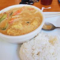 Red Curry · Red curry in coconut milk with red peppers, eggplants, bamboo shoot, carrot and fresh basil....