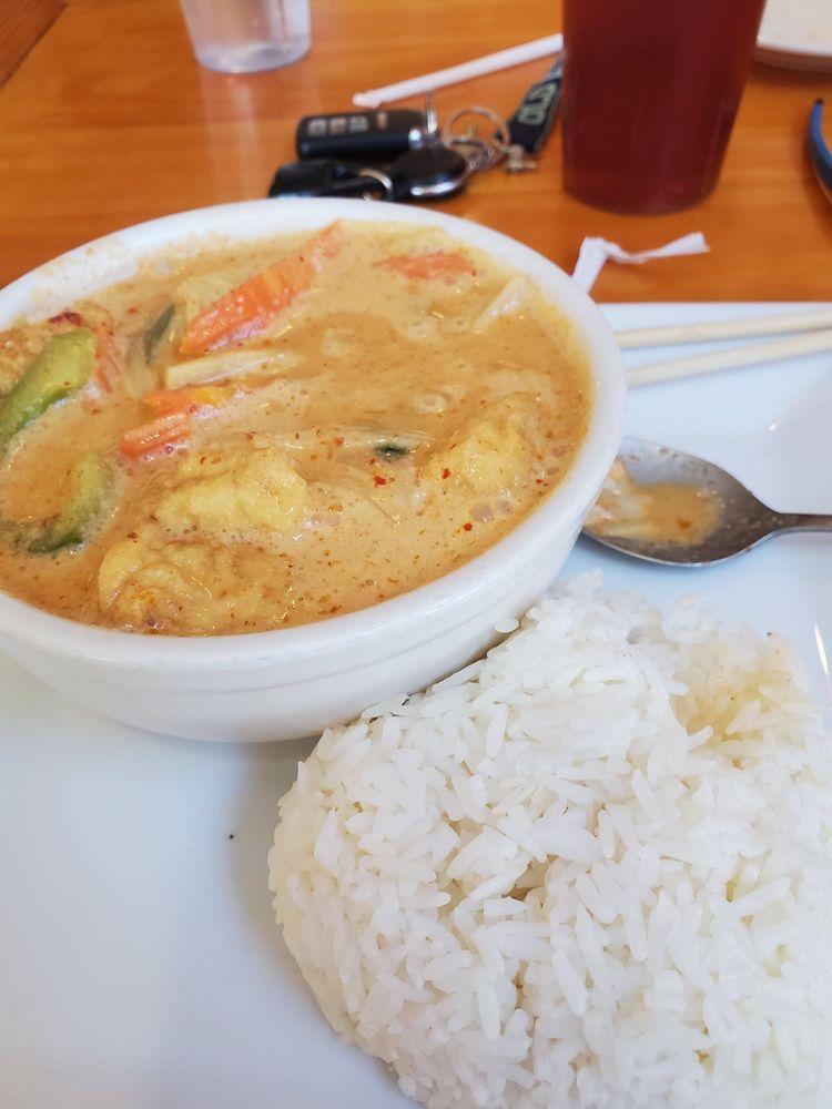 Red Curry · Red curry in coconut milk with red peppers, eggplants, bamboo shoot, carrot and fresh basil. Spicy.