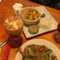 Mango Curry · Chicken red curry, in coconut milk and curry power with onions, fresh mango, red or green pe...