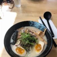 Garlic Tonkotsu Ramen · Garlic flavored pork broth with pork belly topped with egg, sprouts, green onions and nori.