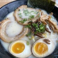 Shoyu Ramen · Soy sauces flavored pork broth with pork belly, topped with egg, bamboo, sprouts and green o...
