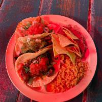 Pinche Combination Plate · Any 3 tacos plus rice, beans and chips.