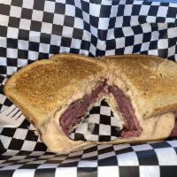 New Yorker Sandwich · Hot pastrami, swiss cheese, coleslaw and Thousand Island dressing on toasted rye served with...