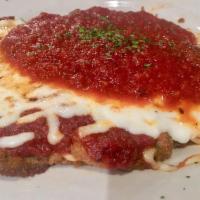 Eggplant Parmigiana · Thin slices of skin on eggplant lightly breaded, flash fried. Topped with Dominick marinara ...