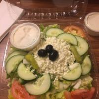 Greek Salad · Fresh lettuce, tomatoes, cucumbers, feta cheese, kalamata olives, green peppers, and red oni...