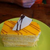 Mango Cake · Layers of vanilla sponge cake, each soaked with mango syrup and imported alphonso mango pure...
