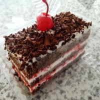 Black Forest Cake · A Biscotts favorite! A moist, chocolate cake, layered and decorated with a light whipped cre...