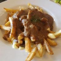 Poutine · Crispy fries loaded with cheddar cheese curds then smothered in our house made gravy.