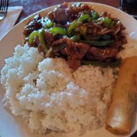 Mongolian Beef · Tender beef strips with sliced bell pepper, onion and carrots stir fried in a spicy Mongolia...