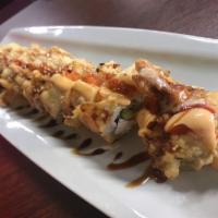 Rio Bravo Roll · Shrimp tempura, spicy crab, cream cheese,  and special sauce on top.