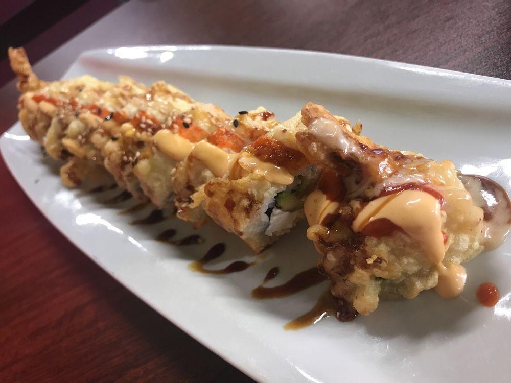 Rio Bravo Roll · Shrimp tempura, spicy crab, cream cheese,  and special sauce on top.