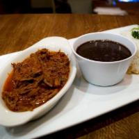 Ropa Vieja · Shredded beef cooked in creole sauce with green peppers, white onions, and herbs. Served wit...
