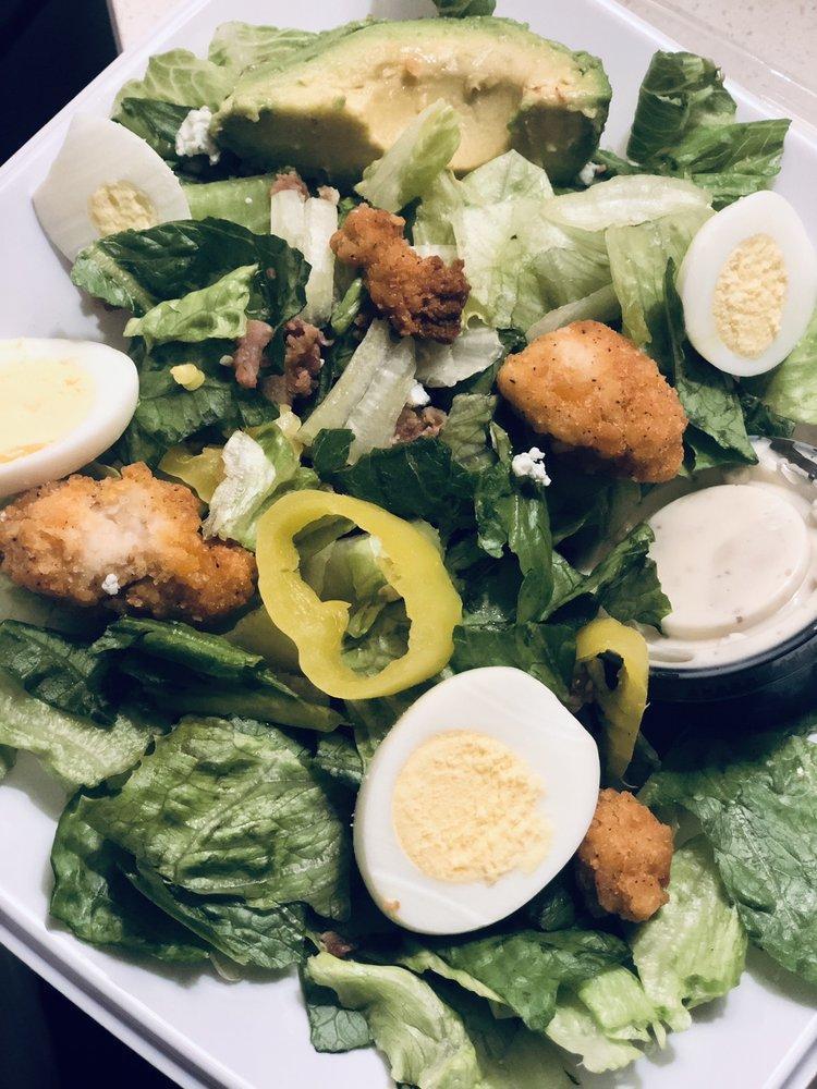 Avocado Cobb Salad · Fresh Avocado enhances this timeless classic! Start with the recommended base of our Romaine/Iceberg Blend. It is served with Grilled Chicken, Diced Tomatoes, Fresh Avocado, Sliced Egg, Smoky Bacon and Bleu Cheese. We recommend our Thousand Island dressing.
