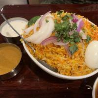 Chicken Dum Biryani · Tender marinated meat or vegetables flavored with exotic spices cooked with basmati rice. Se...