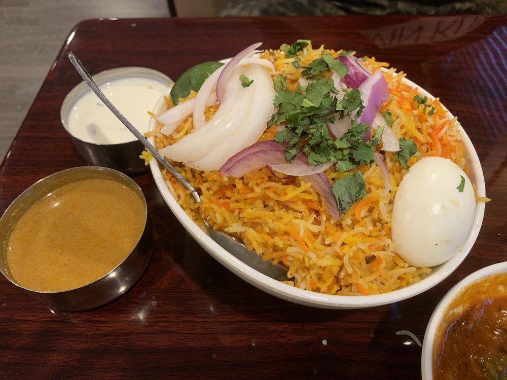 Chicken Dum Biryani · Tender marinated meat or vegetables flavored with exotic spices cooked with basmati rice. Served with mirchi ka salan and raita.