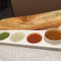 Masala Dosa · Savory crepe filled with mildly spiced mashed potatoes. Served with coconut chutney, ginger ...