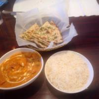 Chicken Tikka Masala · Boneless grilled chicken cooked with tomato, cream and special spices. A divine buttery tast...