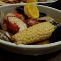 New England Boiled Dinner · Mussels, steamers, lobster, linguica sausage, potatoes and steamed corn.