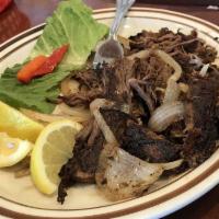 Vaca Frita · Grilled shredded beef.