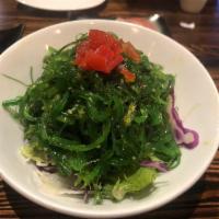 Seaweed Salad · On a bed of fresh mixed green salad.