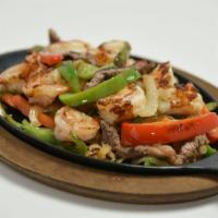 Fajitas · Choice of chicken, pork, beef, chorizo or vegetables.
NOTE: Plate comes with rice, beans, sa...