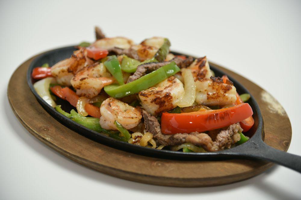 Fajitas · Choice of chicken, pork, beef, chorizo or vegetables.
NOTE: Plate comes with rice, beans, salad, sour cream and guacamole