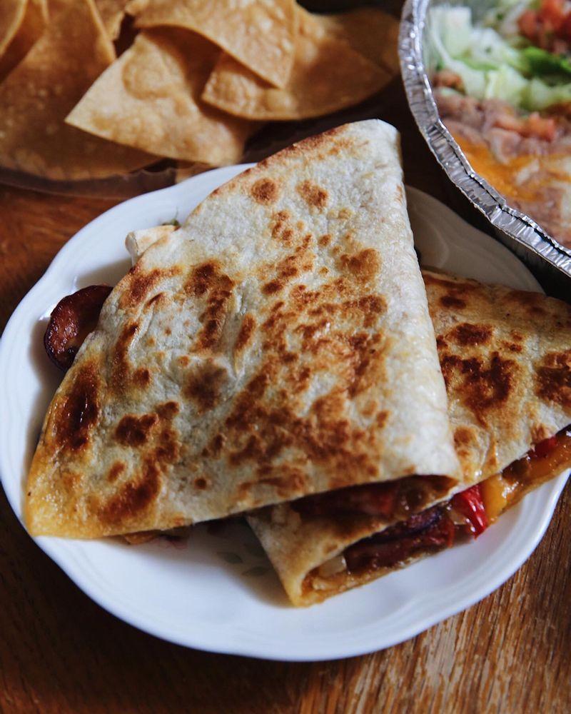 Quesadilla · Grilled, crispy flour tortilla filled cheese and choice of meat chicken, pork, beef, chorizo or vegetables