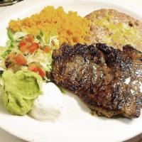 Carne Asada · Grilled marinated steak.
NOTE: Plate comes with rice, beans, salad, sour cream and guacamole