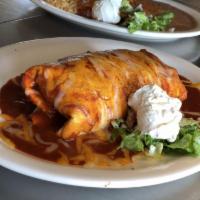 Giant Burrito · Filled with rice, beans, cheese, pico de gallo and choice of shredded beef, pork, chicken, v...