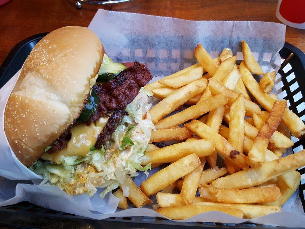 Classic Burger · Bacon, American, tomato, lettuce, house sauce, grilled onion and pickle. Every burger comes with bacon and fries.