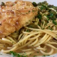 Chicken Piccata · Filet of chicken sauteed in a sauce of lemon, butter, white wine and capers over a bed of pa...