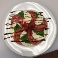 Caprese Salad · Fresh Mozzarella, tomato, and basil.