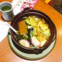 Nabeyaki Udon · Shrimp tempura, chicken, fish cakes, egg, and vegetables with noodles.