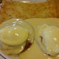Egg Benedict · Grilled muffin, sliced ham, and poached eggs topped off with hollandaise sauce. Served with ...