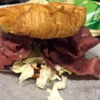 Slamwich · Thinly sliced pastrami topped with melted Swiss cheese, coleslaw and our honey based Russian...
