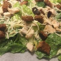 Chicken Caesar Salad · Tender chunks of marinated chicken breast served over a bed of romaine lettuce tossed with c...