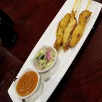 Chicken Satay 5 Skewers · Skewered chicken, marinated in coconut milk and curry. Served with cucumber vinaigrette and ...