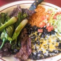 Carne Asada · Skirt steak broiled in a special way. Served with guacamole.