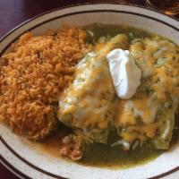 Enchilada Suiza · 2 corn tortillas stuffed with your choice of filling. Topped with a delicious green tomatill...