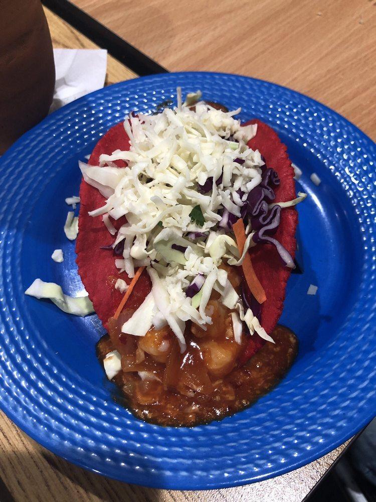 Taco Rojo · Diablo shrimp in a homemade red tortilla topped with red cabbage and cheese.