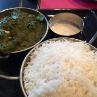 Palak Paneer · Spinach and cottage cheese cooked with tomatoes, onions and Indian spices.