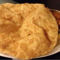 Channa Batura · Extra-large deep-fried puffy bread served with chickpeas curry. Paneer can be replaced with ...