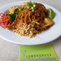 Pad Thai · Wok tossed rice noodles, garlic, eggs, bean sprouts, and scallions. Served with crushed pean...