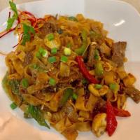Spicy Drunken Noodles · Wok tossed rice noodles, garlic, eggs, bell peppers, jalapeno, fresh mushrooms, cashews, sca...