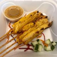 Grilled Chicken Satay · 5 pieces. 
Marinated coconut curry, chicken breast, lightly grilled,
and served with peanut ...