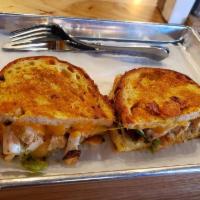 Fajita Grilled Cheese Sandwich · Grilled chicken, sliced peppers, onions, cheddar, habanero jack, and house-made cilantro-lim...