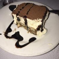 Tiramisu · Espresso-soaked sponge cake layered with mascarpone cheese and cocoa