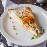 Chicken Sambusek · Curried chicken mixed with onions, sweet peas, fine herbs, and spices, folded into a pita pi...
