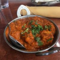 Chicken Tikka Masala · Boneless chicken cooked in house special masala sauce with sliced onions, tomatoes, ginger, ...