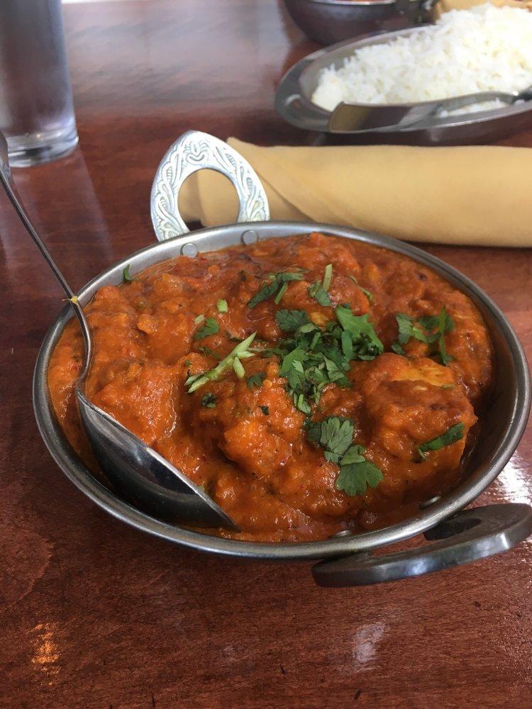 Chicken Tikka Masala · Boneless chicken cooked in house special masala sauce with sliced onions, tomatoes, ginger, and bell peppers. Served with basmati rice. Prepared with white meat.